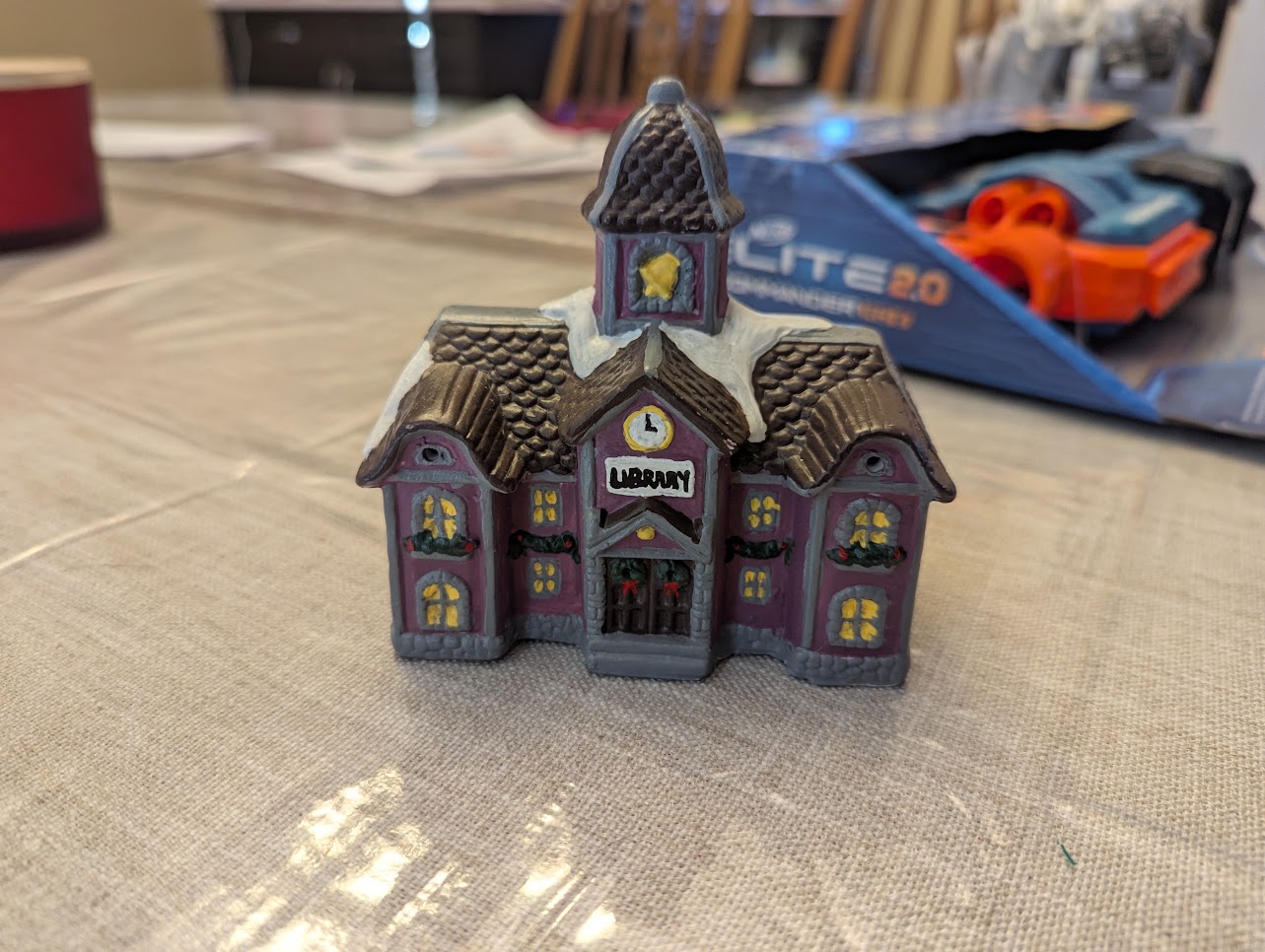 A picture of a tiny Christmas village library I painted
